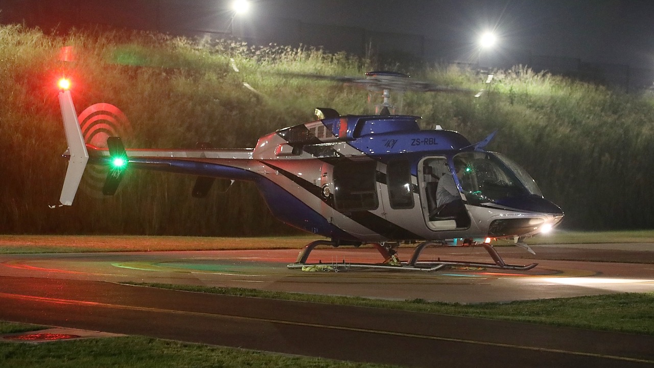 Bell 407 ZS-RLO doing an LED banner lift from Ultimate Heliport, Midrand